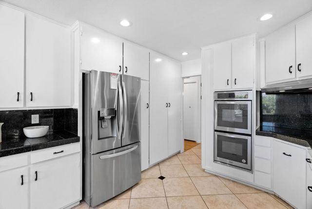 a bedroom with a bed and lamp