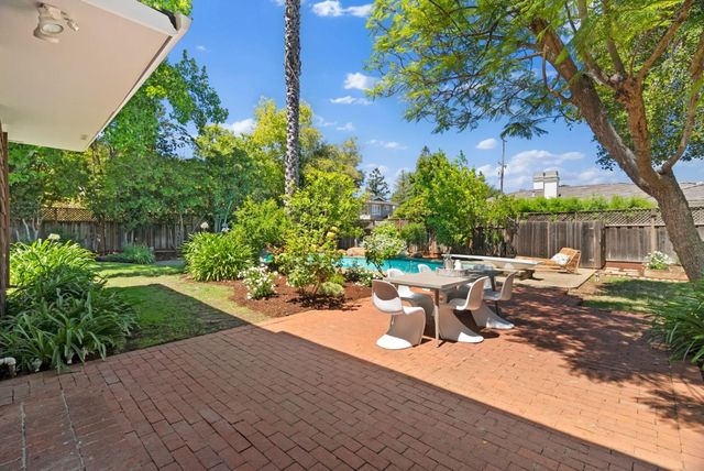 a view of backyard with green space