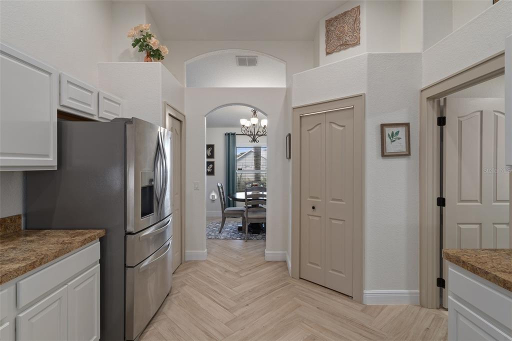 11370 Terrell Road Spring Hill, FL 34608 - Photo 19 of 54 a kitchen with a refrigerator and a sink
