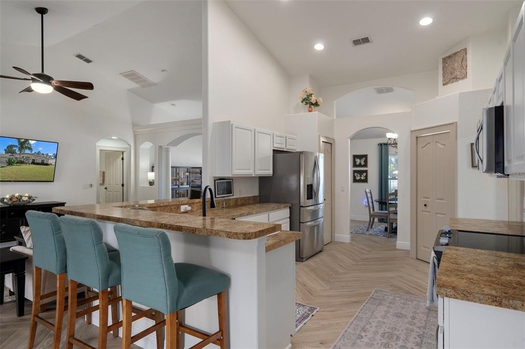 11370 Terrell Road Spring Hill, FL 34608 - Photo 23 of 54 a large kitchen with a table and chairs