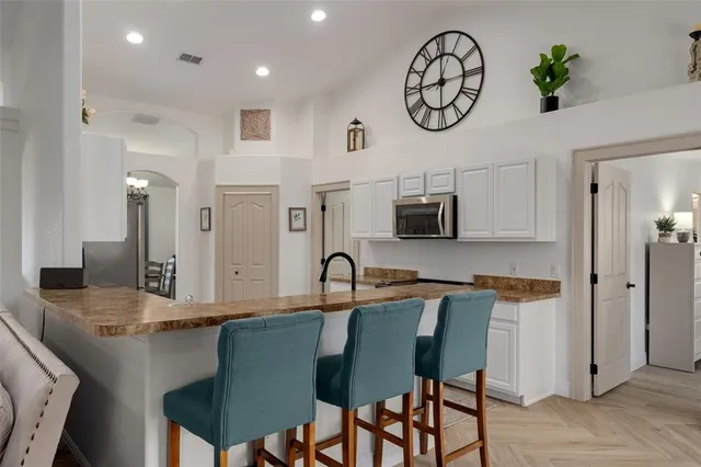 an empty room with windows and entrance