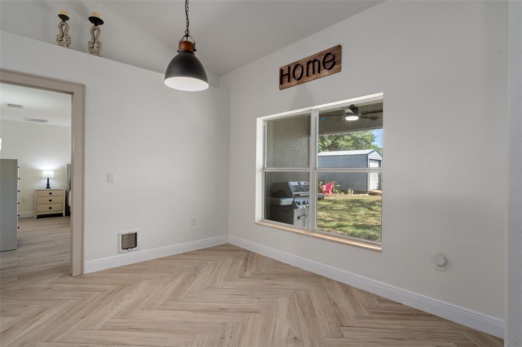 11370 Terrell Road Spring Hill, FL 34608 - Photo 25 of 54 a view of an entryway with wooden floor