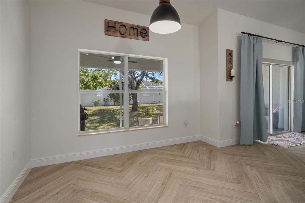 11370 Terrell Road Spring Hill, FL 34608 - Photo 26 of 54 an empty room with windows and entrance