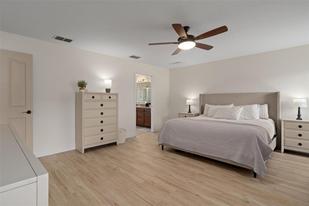 11370 Terrell Road Spring Hill, FL 34608 - Photo 27 of 54 a bedroom with a bed and a dresser