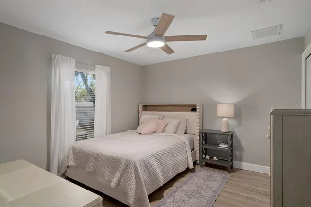 a bed room with a bed and a television