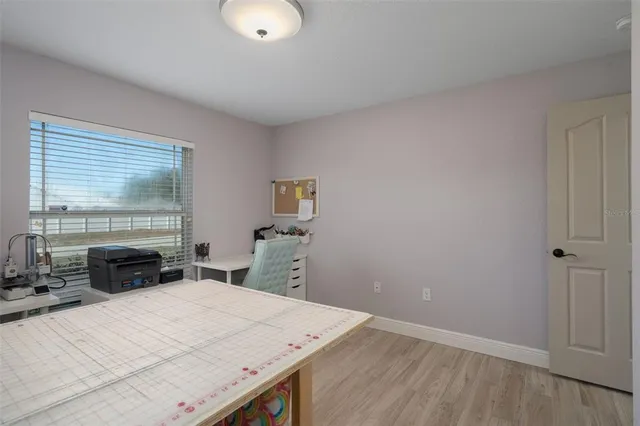 a bathroom with a sink a toilet a mirror and a shower