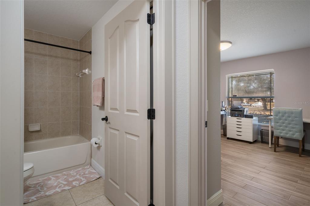 11370 Terrell Road Spring Hill, FL 34608 - Photo 42 of 54 a bathroom with a tub shower and sink
