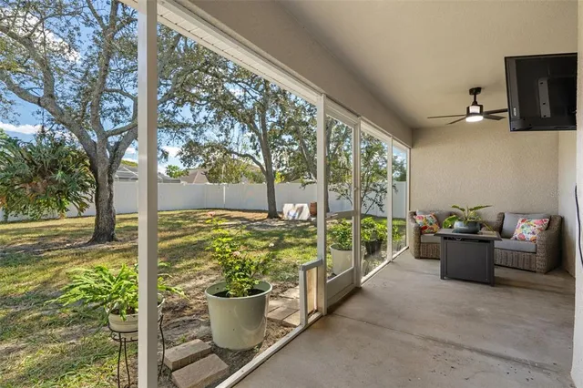 a front view of a house with patio and garden
