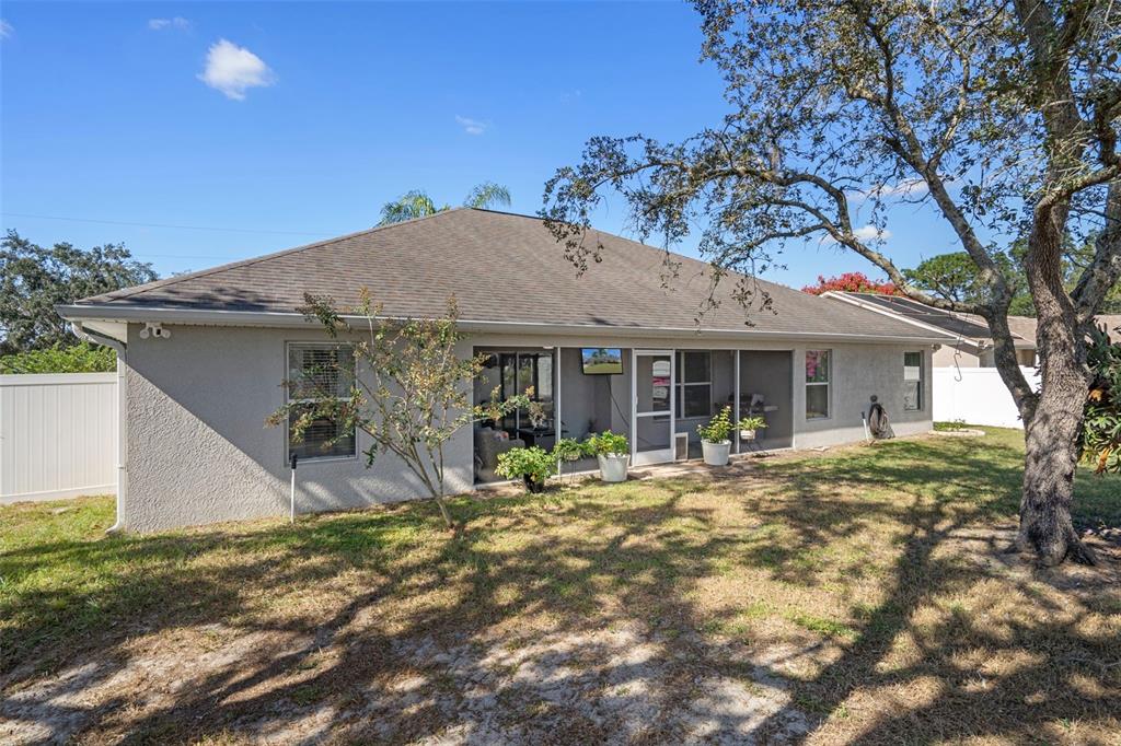 11370 Terrell Road Spring Hill, FL 34608 - Photo 46 of 54 a front view of a house with garden