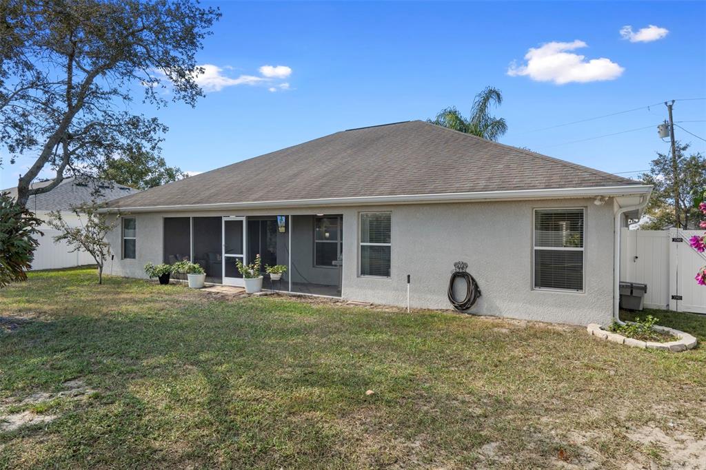 11370 Terrell Road Spring Hill, FL 34608 - Photo 48 of 54 a front view of a house with patio and garden