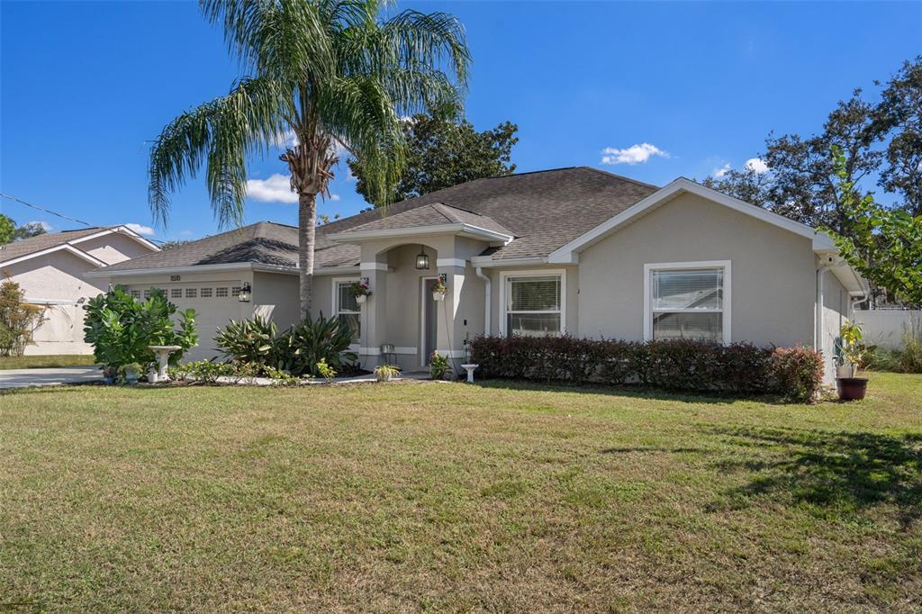 11370 Terrell Road Spring Hill, FL 34608 - Photo 6 of 54 a front view of house with yard and green space