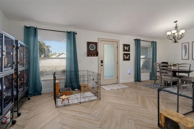 a living room with lots of furniture and white walls