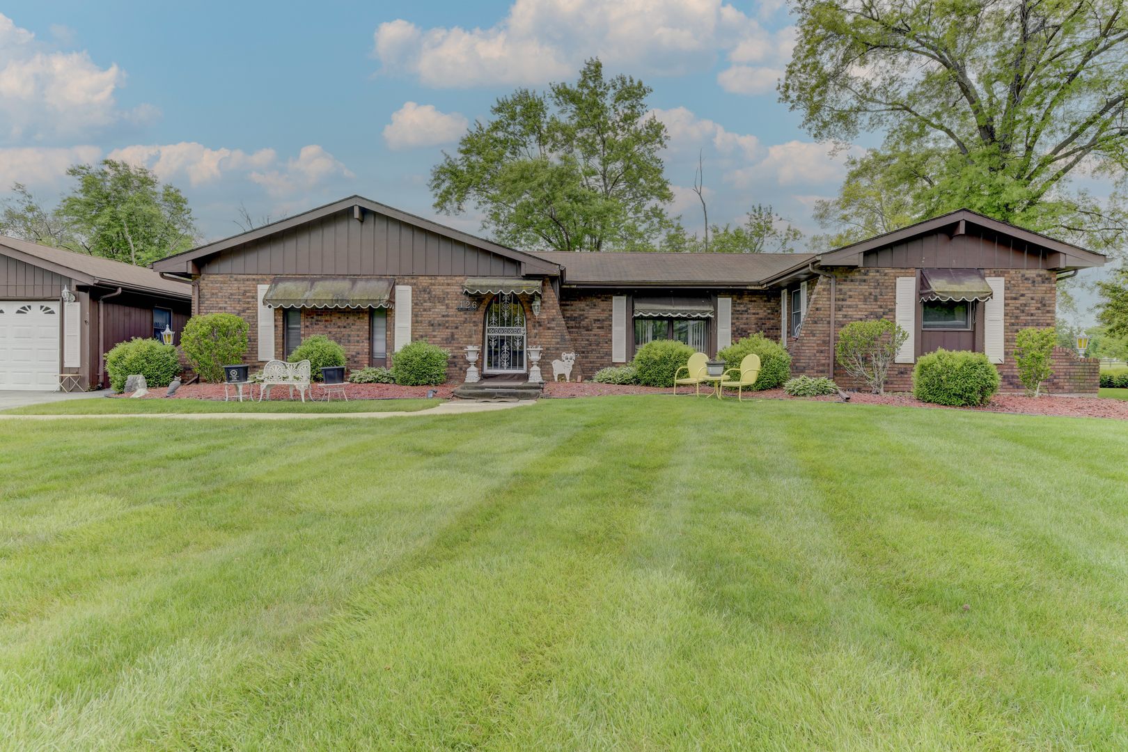 126 Denell Drive Crete, IL 60417 - Photo 2 of 30 a front view of house with yard and green space