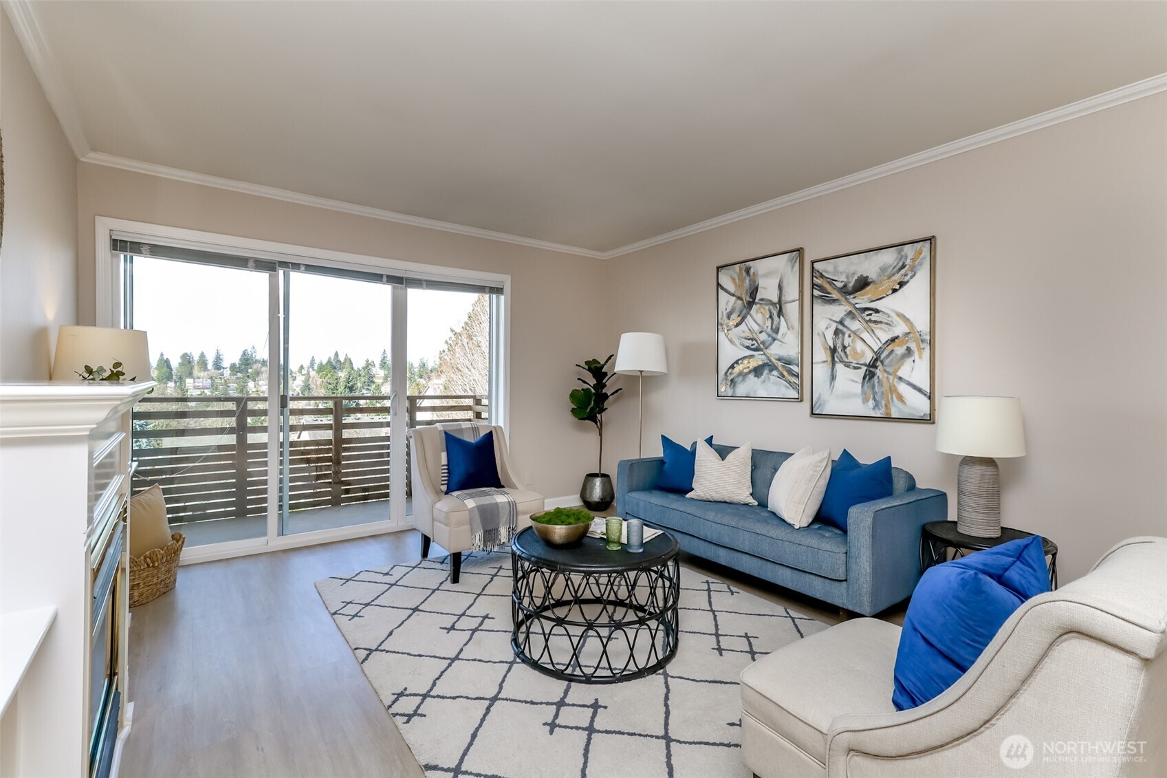 4444 44th Avenue Southwest, Unit 405 Seattle, WA 98116 - Photo 13 of 32 a living room with furniture and a floor to ceiling window