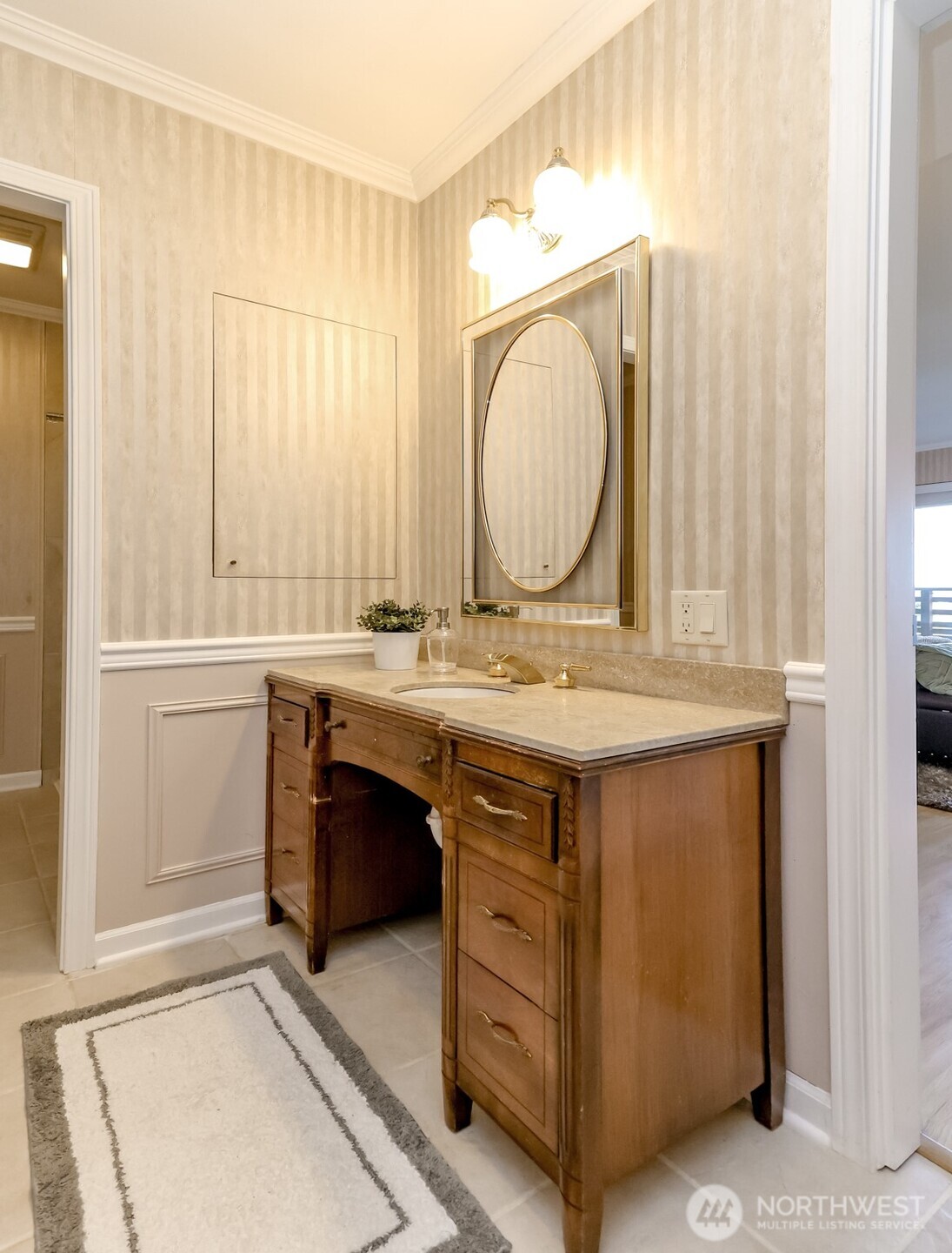 4444 44th Avenue Southwest, Unit 405 Seattle, WA 98116 - Photo 19 of 32 a bathroom with a sink and a mirror