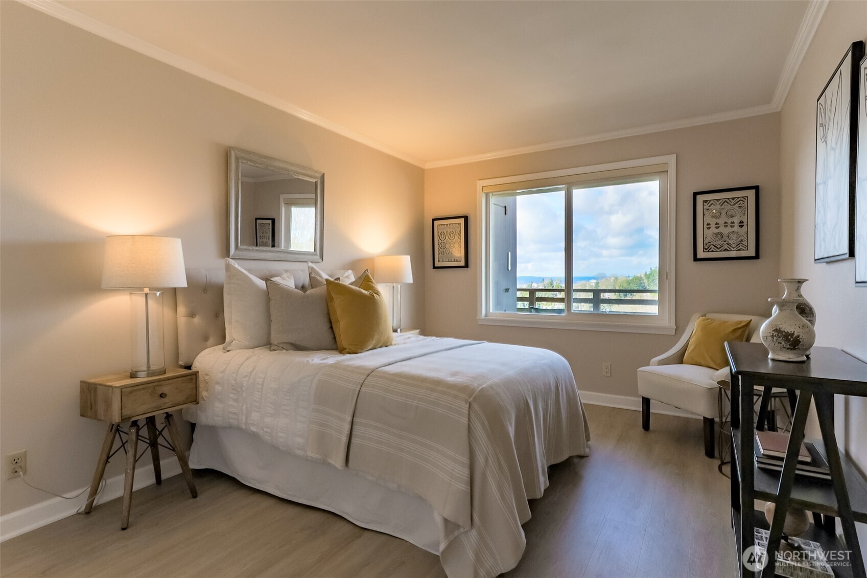 4444 44th Avenue Southwest, Unit 405 Seattle, WA 98116 - Photo 22 of 32 a bedroom with a bed and a large window