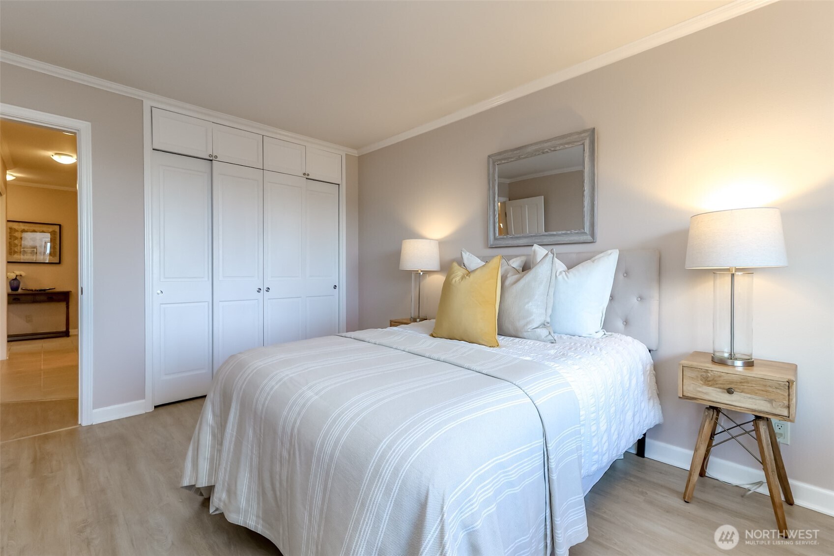 4444 44th Avenue Southwest, Unit 405 Seattle, WA 98116 - Photo 23 of 32 a bedroom with a bed and a table
