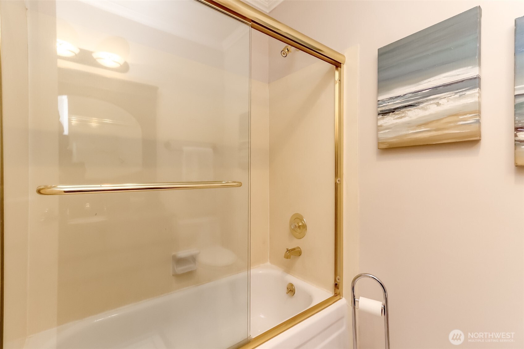 4444 44th Avenue Southwest, Unit 405 Seattle, WA 98116 - Photo 25 of 32 a bathroom with a glass shower door