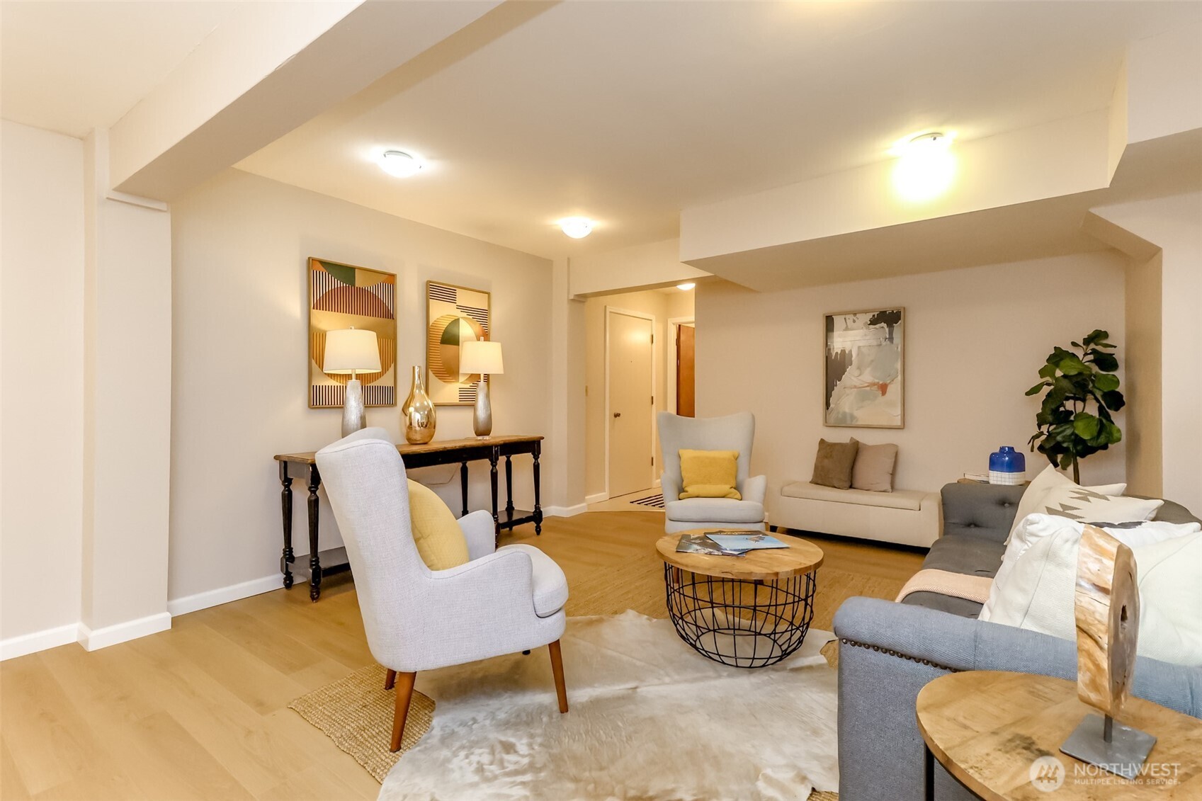 4444 44th Avenue Southwest, Unit 405 Seattle, WA 98116 - Photo 26 of 32 a living room with furniture and a potted plant