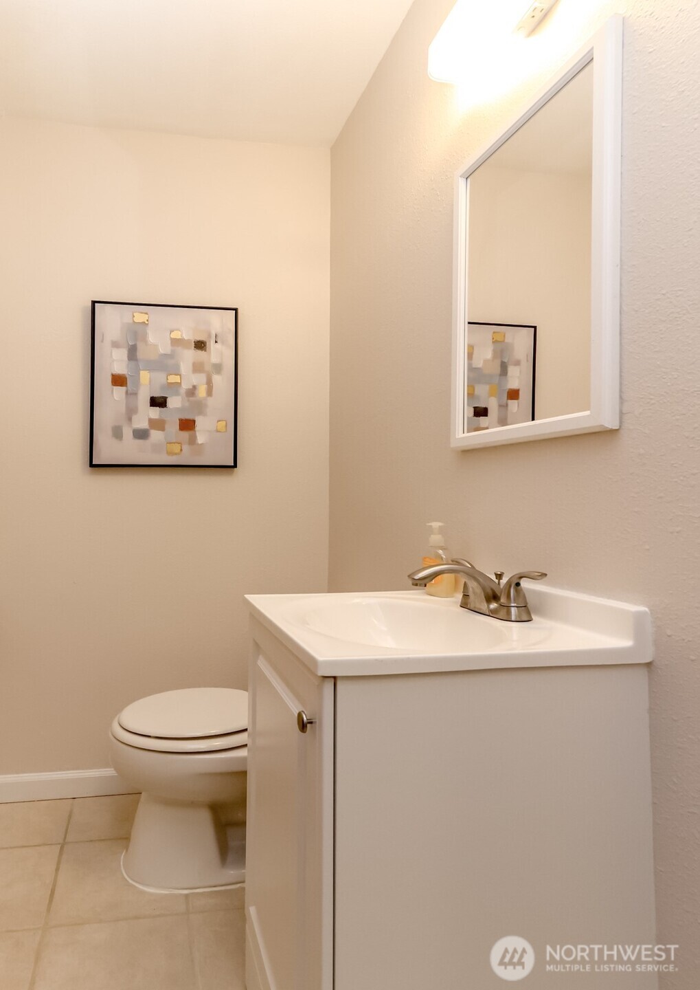 4444 44th Avenue Southwest, Unit 405 Seattle, WA 98116 - Photo 32 of 32 a bathroom with a toilet sink and mirror