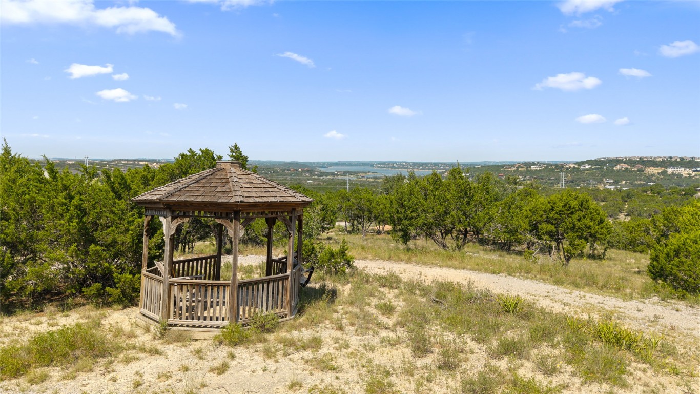 3301 R O Drive Spicewood, TX 78669 - Photo 32 of 37 a view of a swimming pool with a patio