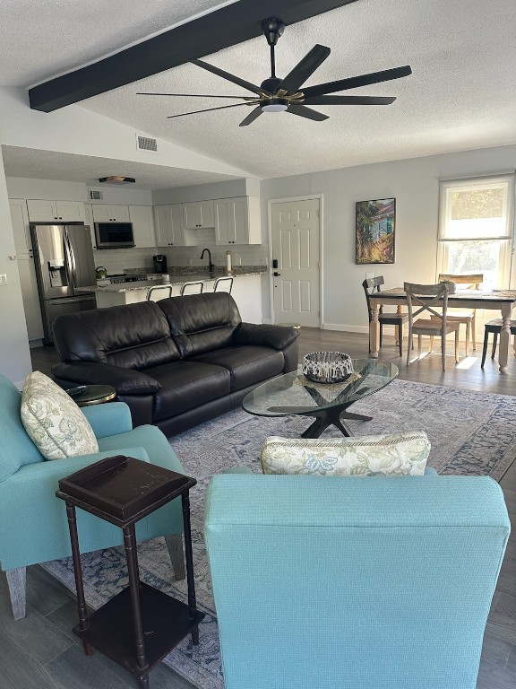 514 South 4th Street Fernandina Beach, FL 32034 - Photo 5 of 13 a living room with furniture and a dining table with kitchen view
