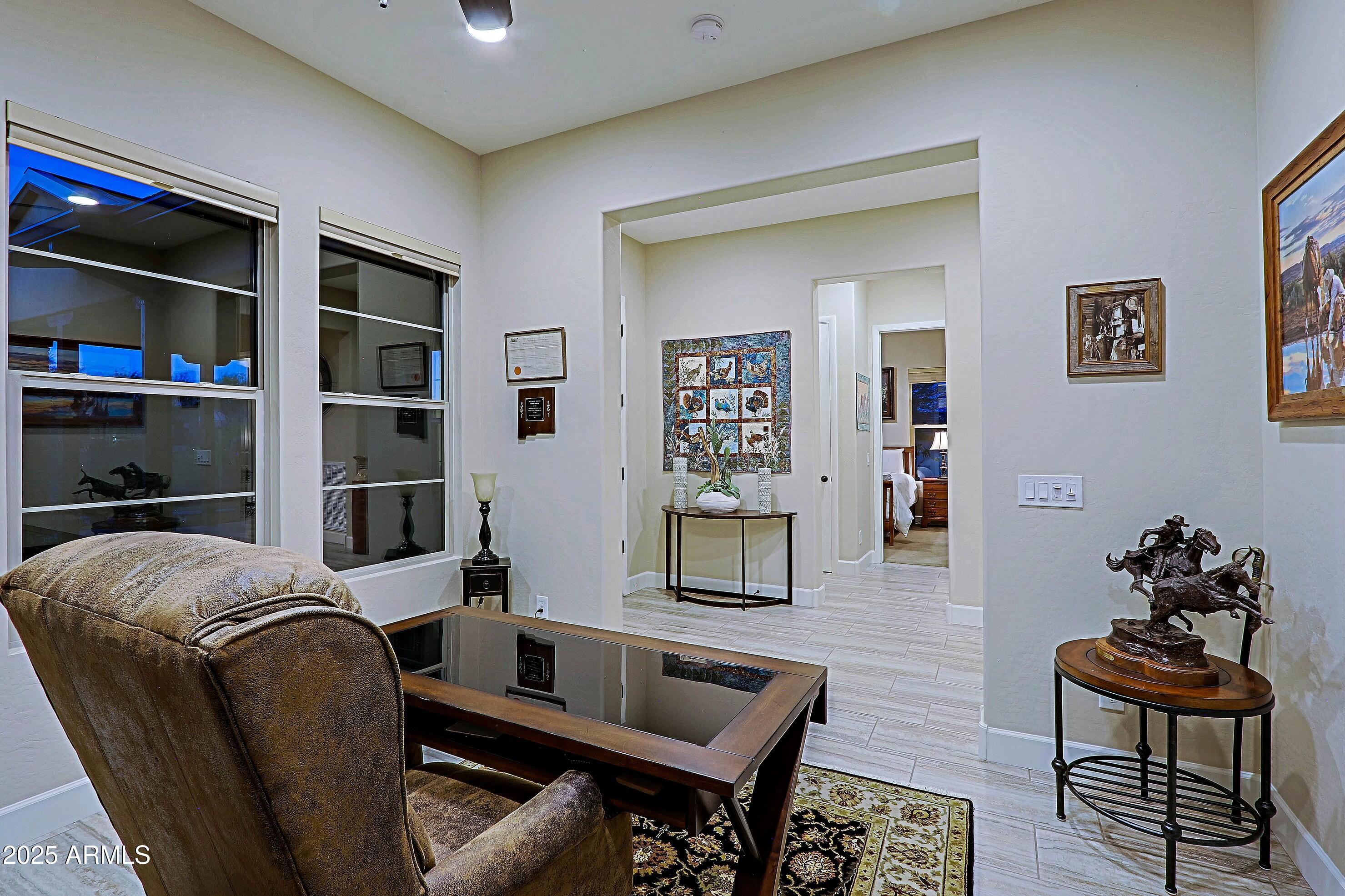 17249 East Fort Verde Road Rio Verde, AZ 85263 - Photo 3 of 48 a livingroom with workspace and a couch
