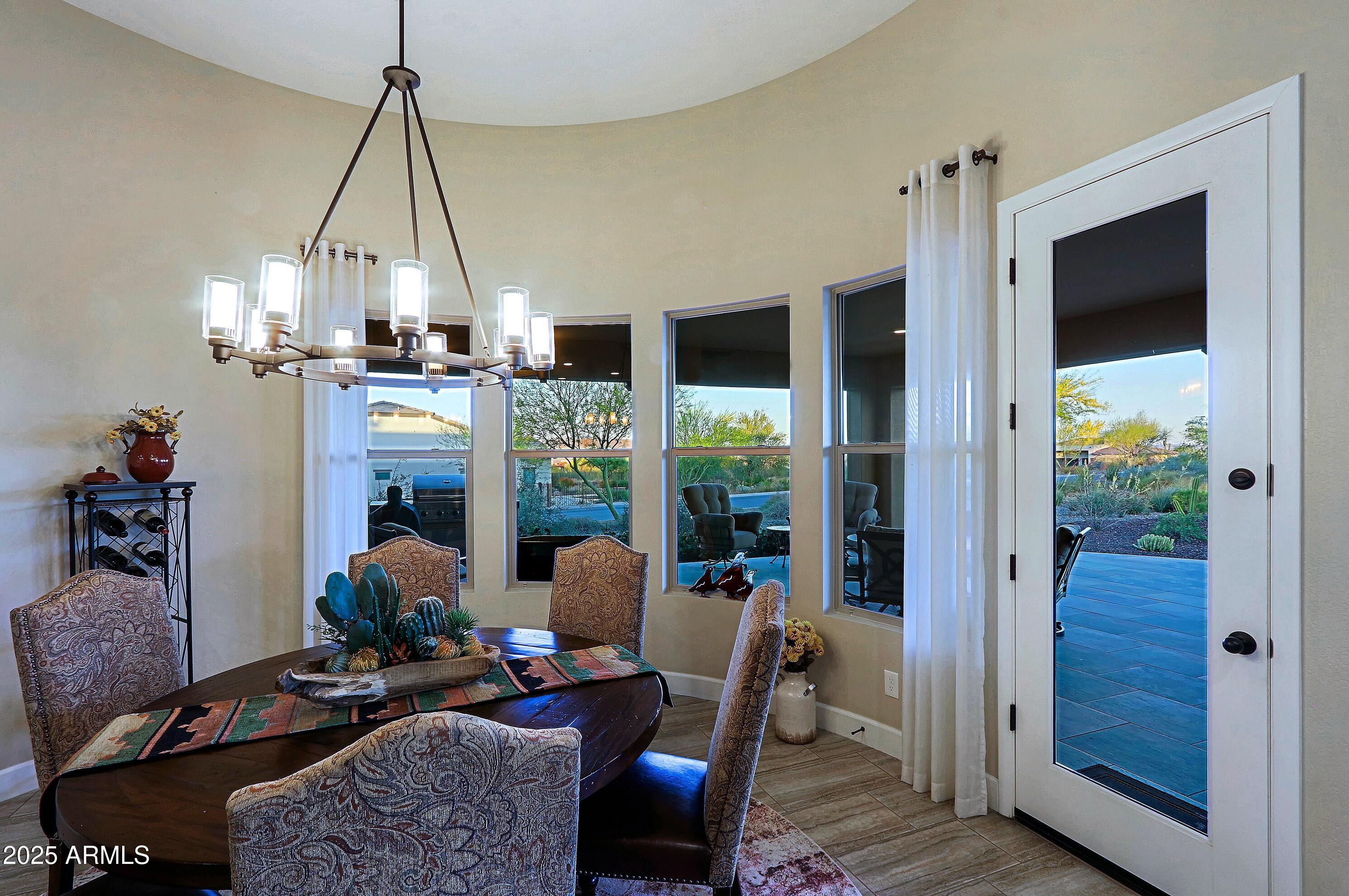 17249 East Fort Verde Road Rio Verde, AZ 85263 - Photo 5 of 48 a dining room with furniture a chandelier and window