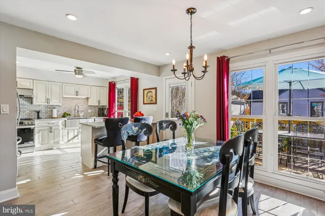 a kitchen with stainless steel appliances granite countertop a stove sink and cabinets