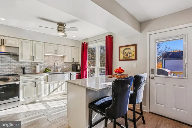 a bedroom with a bed dresser and a window