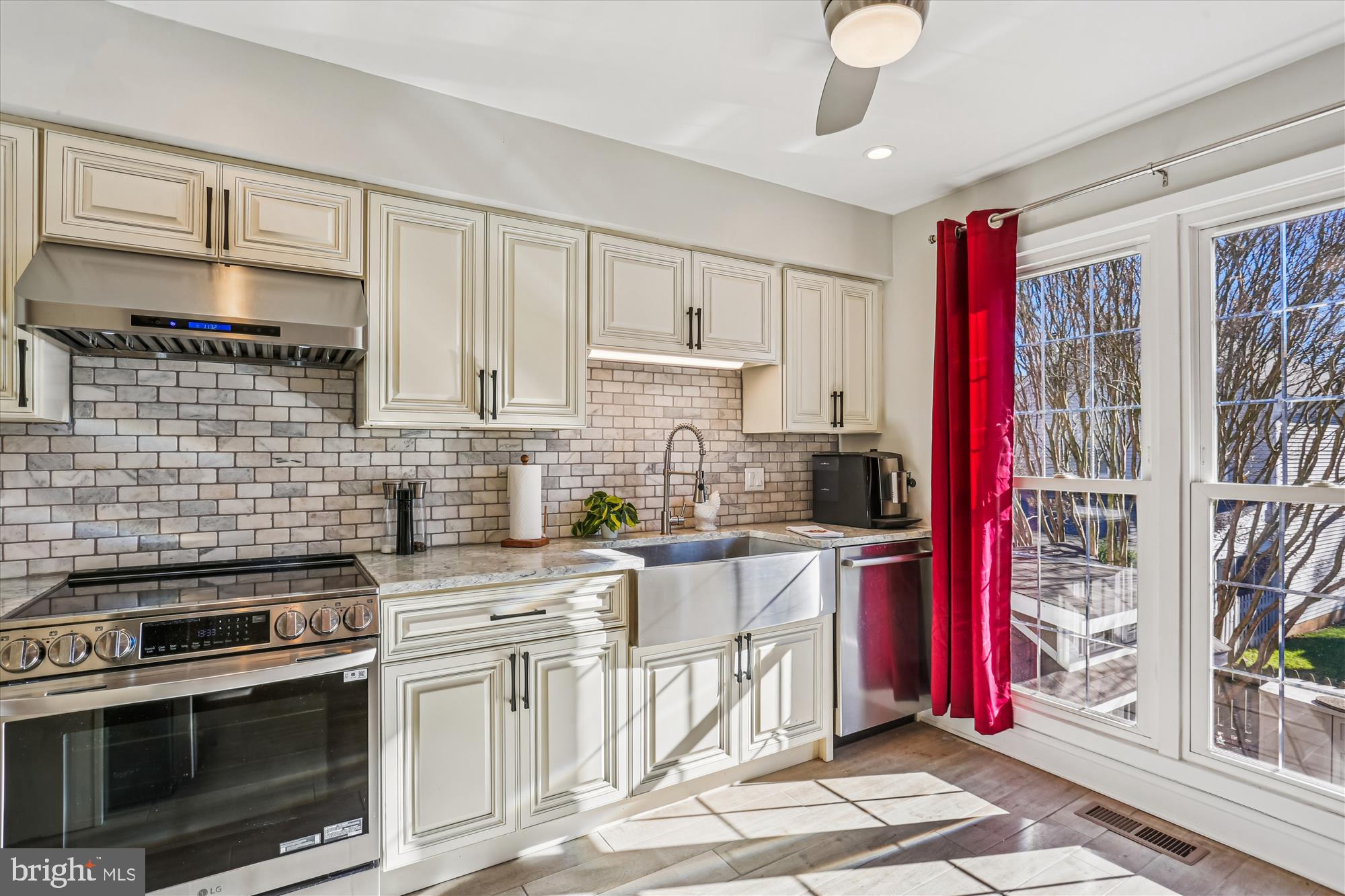 20510 Bargene Way Germantown, MD 20874 - Photo 21 of 97 a kitchen with stainless steel appliances granite countertop a stove sink and cabinets