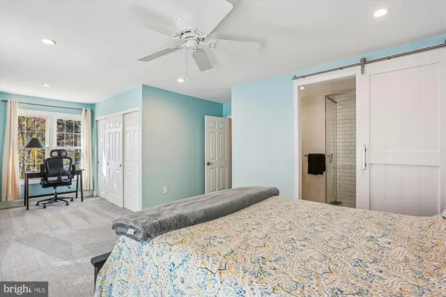 a view of a livingroom with furniture and a window