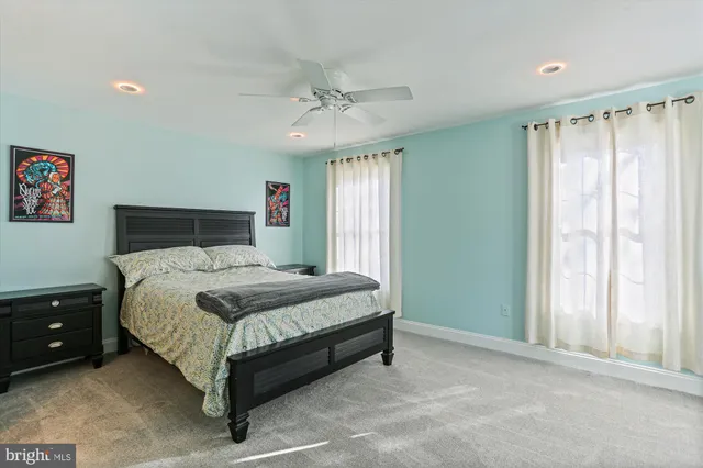 a view of a chair and table and potted on the side of the house