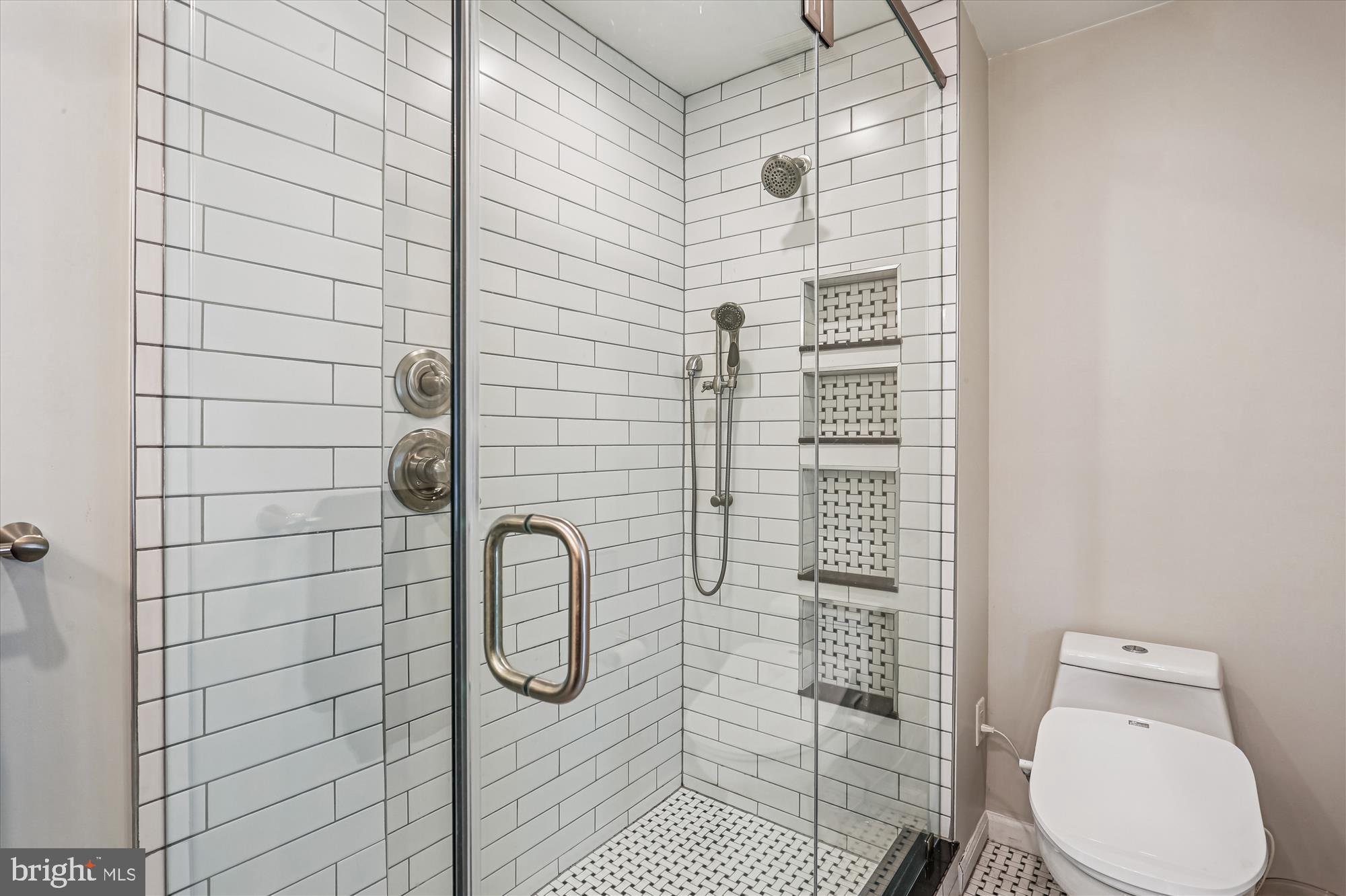 20510 Bargene Way Germantown, MD 20874 - Photo 34 of 97 a bathroom with a toilet and a shower