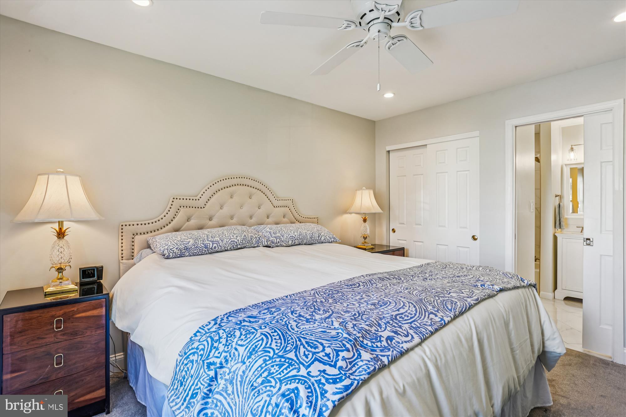 20510 Bargene Way Germantown, MD 20874 - Photo 39 of 97 a bedroom with a large bed and a chandelier