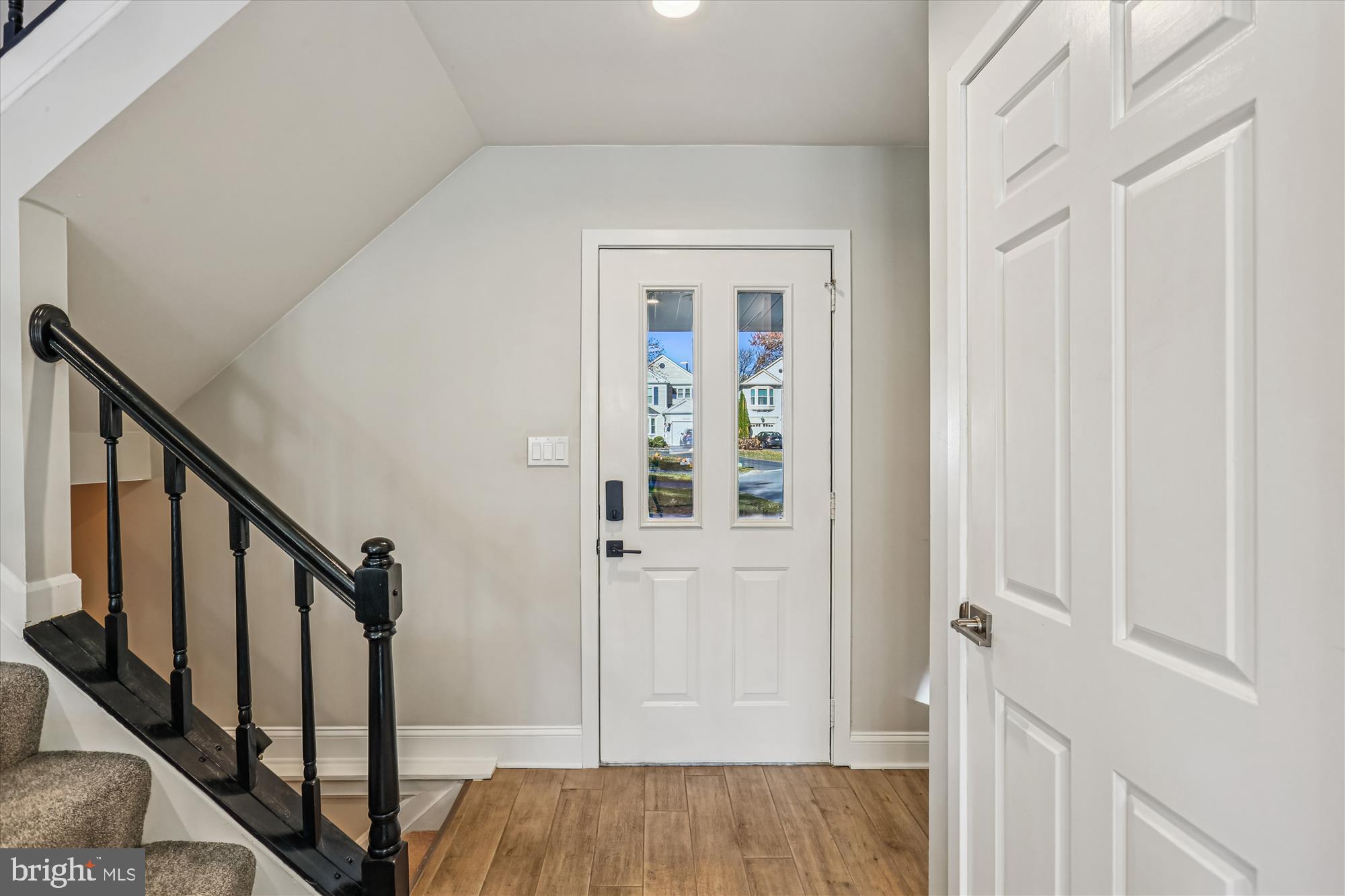 20510 Bargene Way Germantown, MD 20874 - Photo 5 of 97 a view of a hallway with wooden floor and entryway