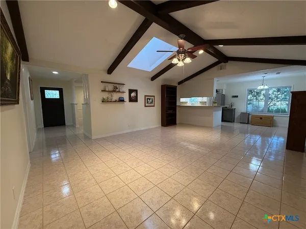 a view of a livingroom with furniture and chandelier