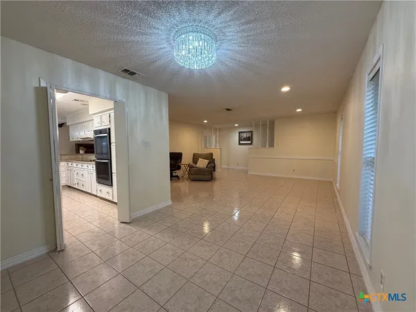 a view of livingroom with kitchen view