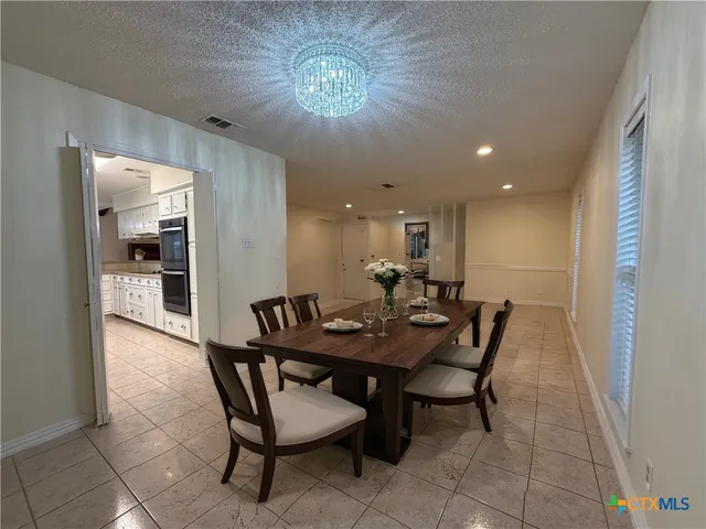 a view of a dining room with furniture