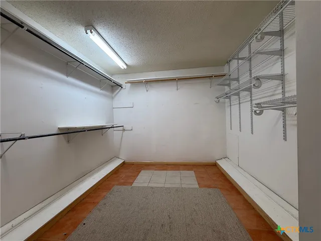 a view of a room with racks on the wall