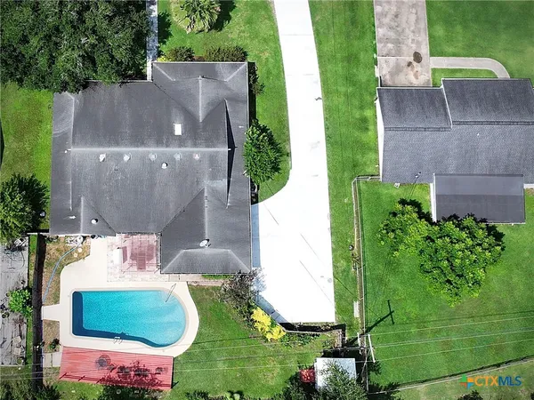 an aerial view of a house with outdoor space