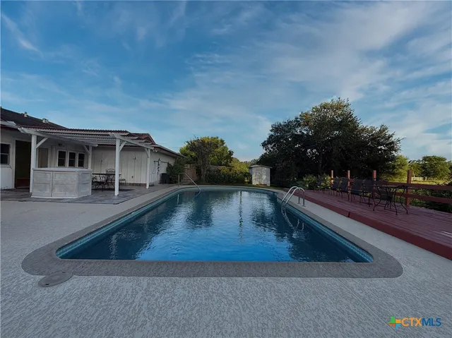 a view of a house with swimming pool