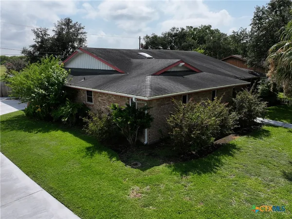 a view of backyard with green space