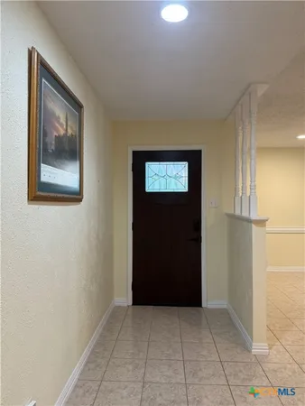 a view of an empty room and closet area
