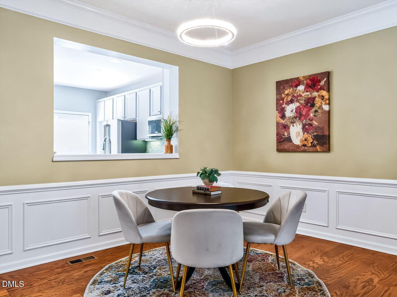 2512 Blooming Street Raleigh, NC 27612 - Photo 11 of 33 a dining room with furniture and wooden floor