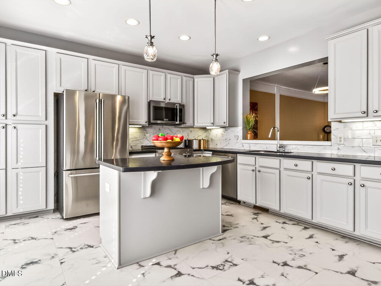 2512 Blooming Street Raleigh, NC 27612 - Photo 15 of 33 a kitchen with stainless steel appliances a refrigerator sink and microwave