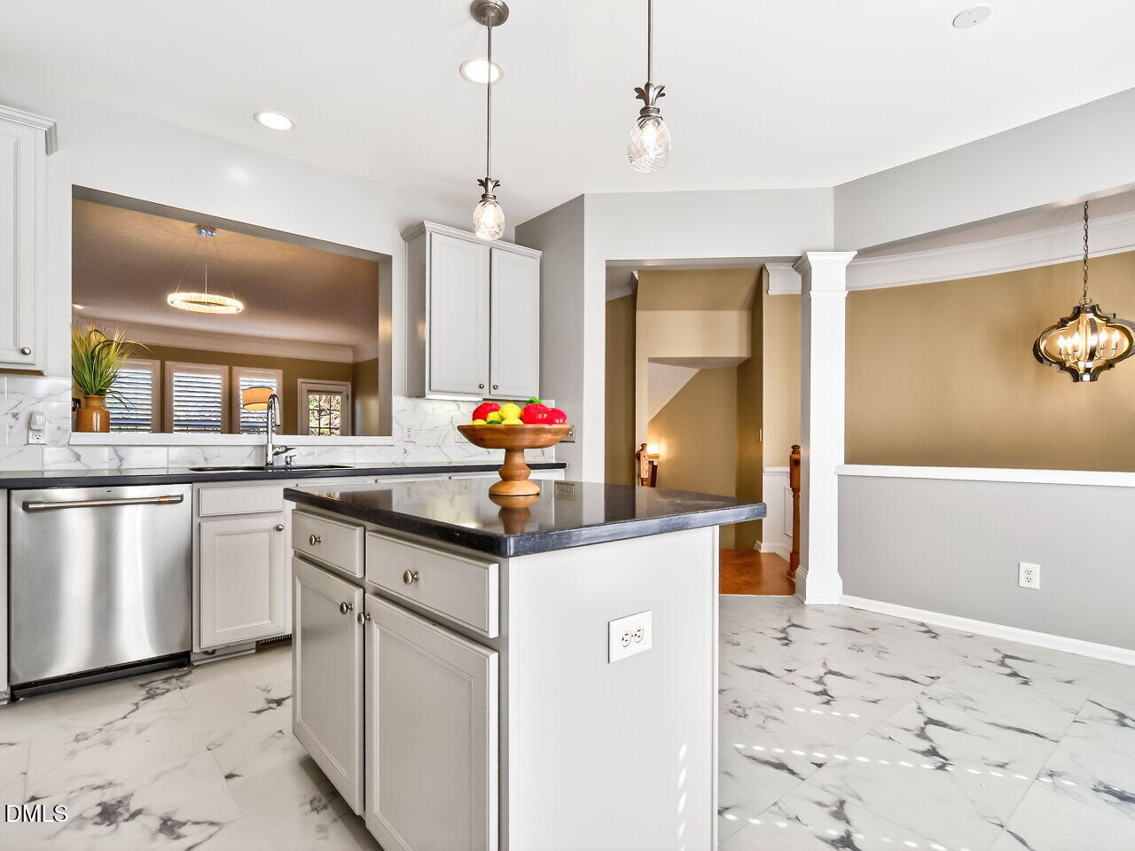 2512 Blooming Street Raleigh, NC 27612 - Photo 16 of 33 a kitchen with stainless steel appliances granite countertop a sink a stove and a refrigerator