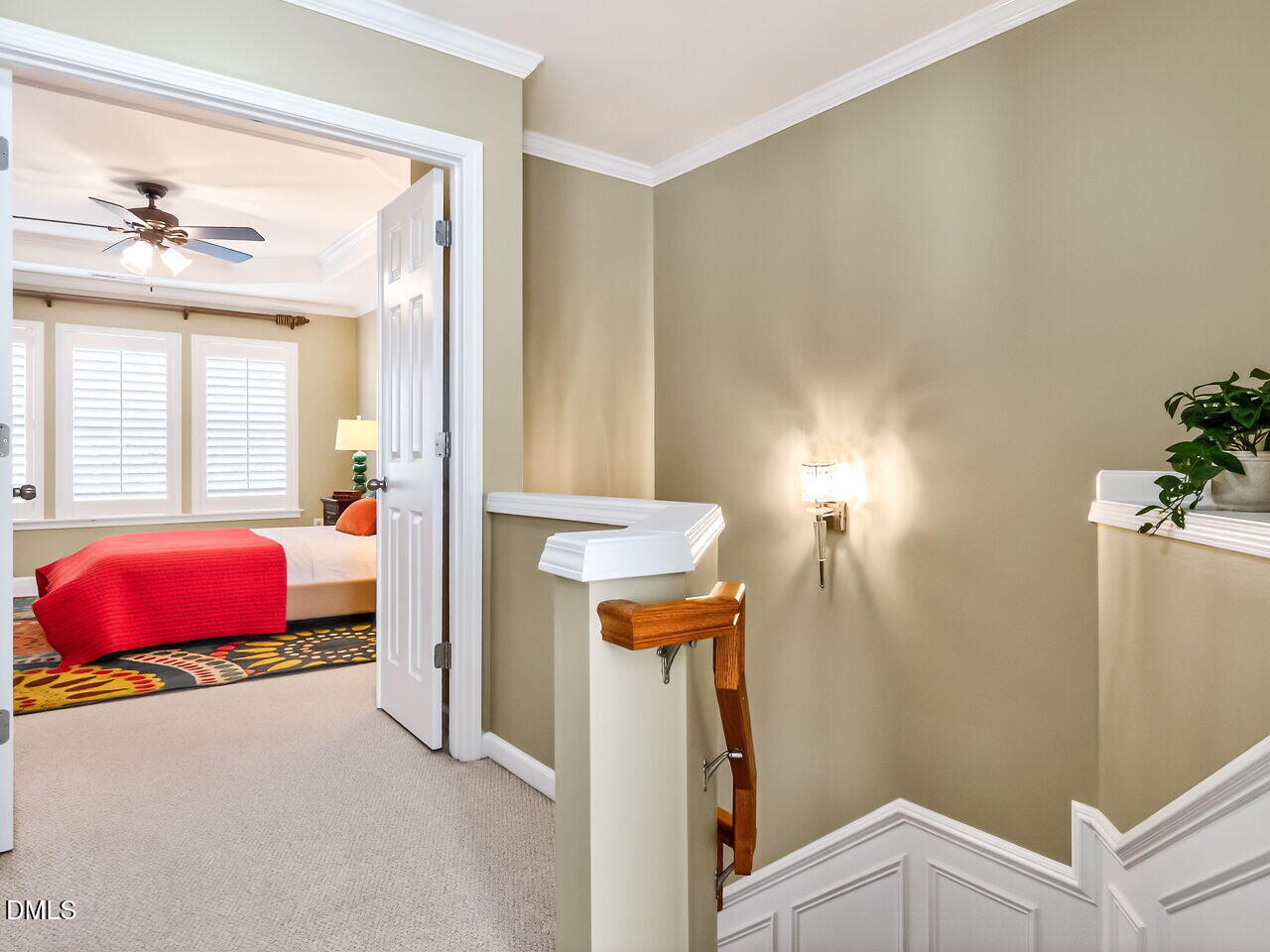 2512 Blooming Street Raleigh, NC 27612 - Photo 20 of 33 a bedroom with a bed and a potted plant