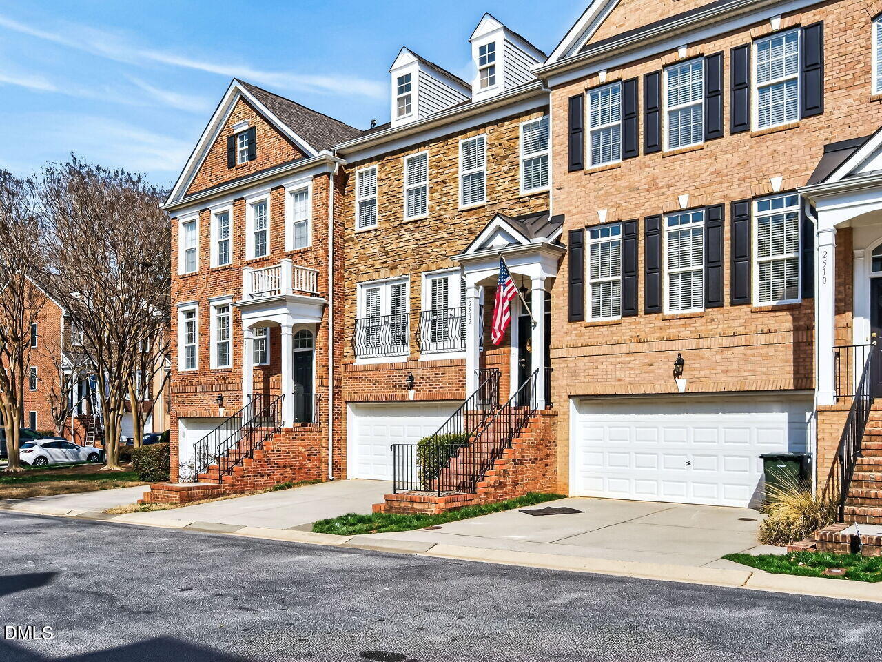 2512 Blooming Street Raleigh, NC 27612 - Photo 2 of 33 a front view of a residential apartment building with a yard