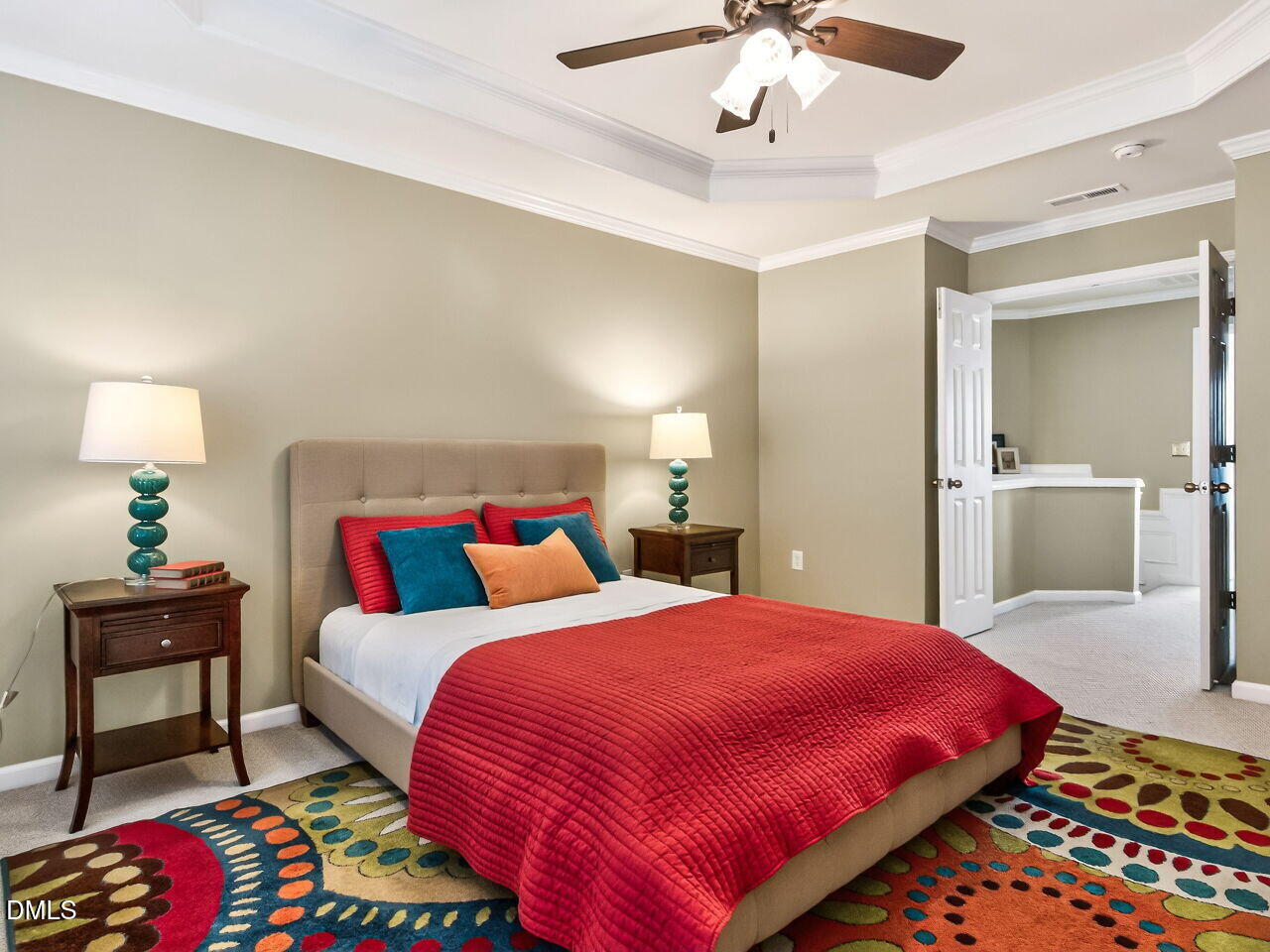 2512 Blooming Street Raleigh, NC 27612 - Photo 22 of 33 a bedroom with a bed and a chandelier